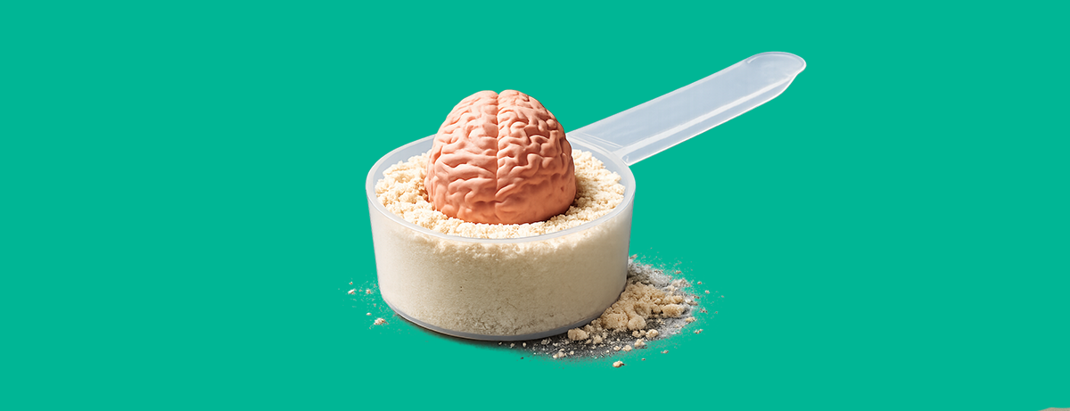Creatine powder with mini plastic brain in scoop