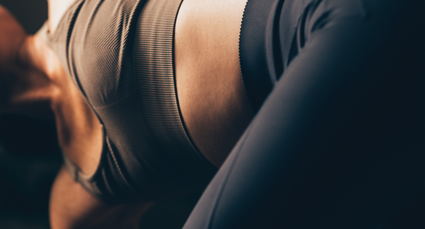 Female in exercise clothes stretching