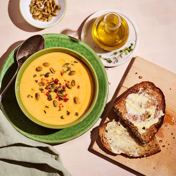 Butternut squash soup on a beige background