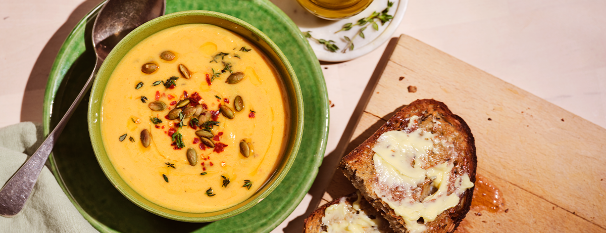 Butternut squash soup on a beige background