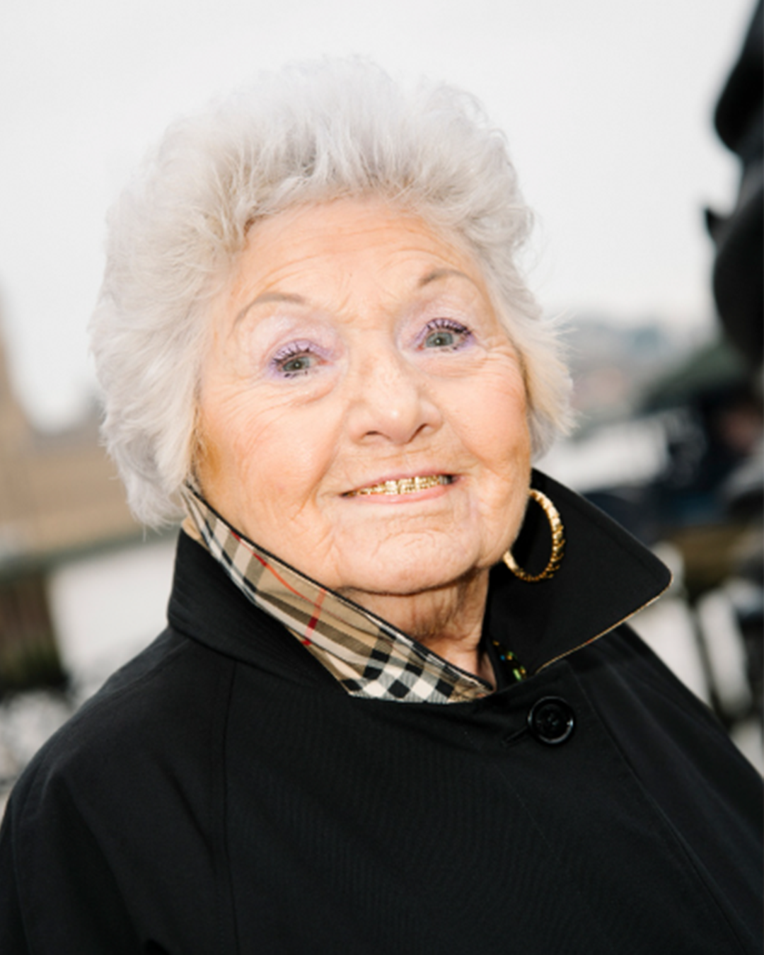 Grime grandma smiling at camera