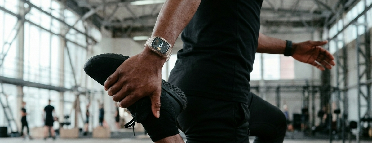 Male stretching in gym setting