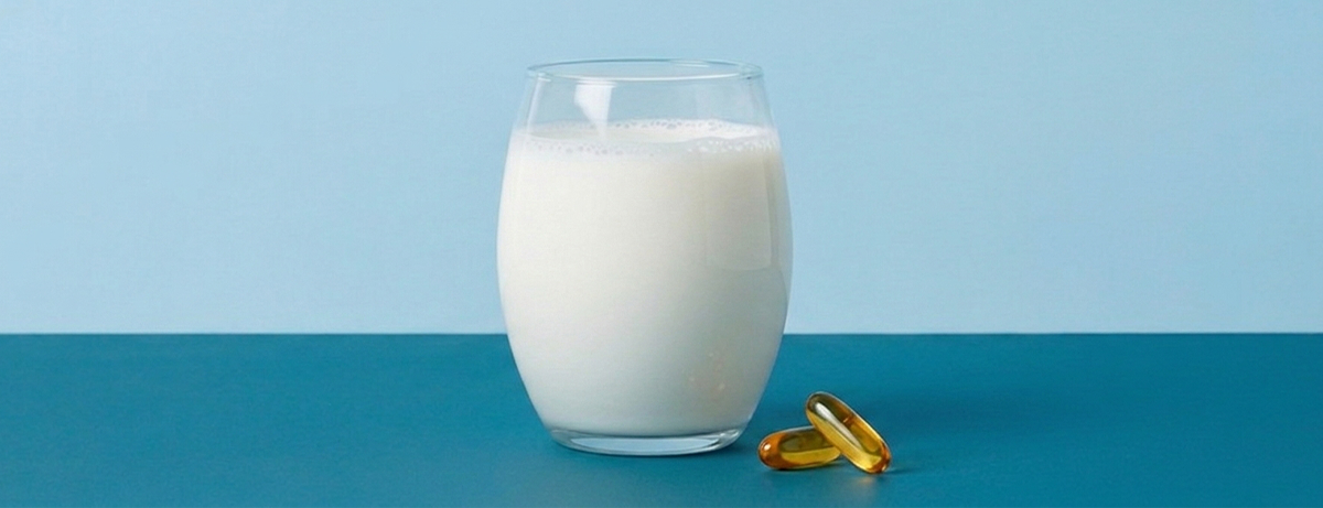 Glass of milk on a blue background