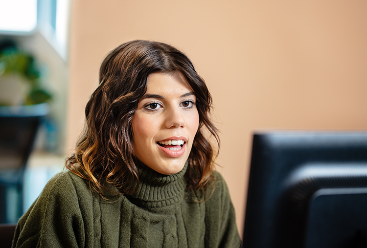 Female sitting in front of computer