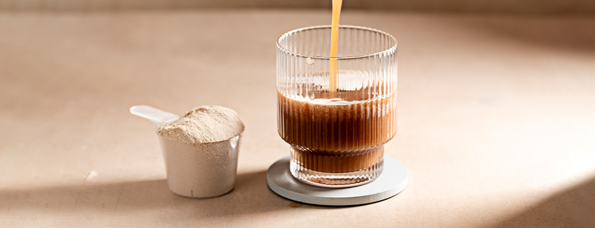 Glass of creatine on brown table