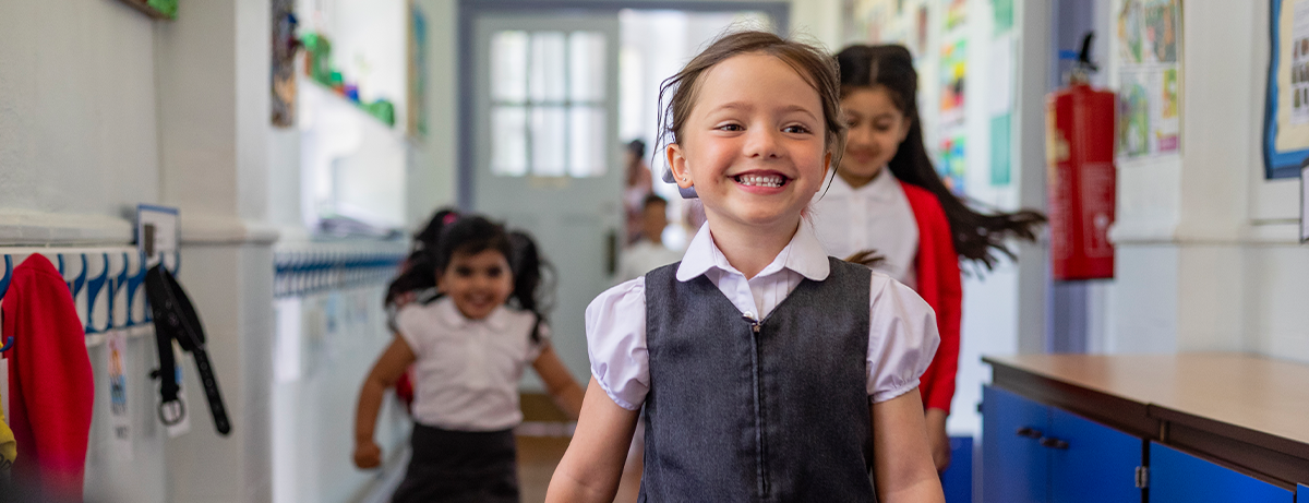 school kid walking down school corridor