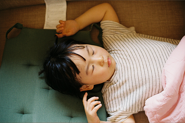 Young child asleep on sofa