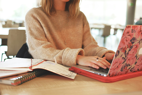 female on laptop in office setting