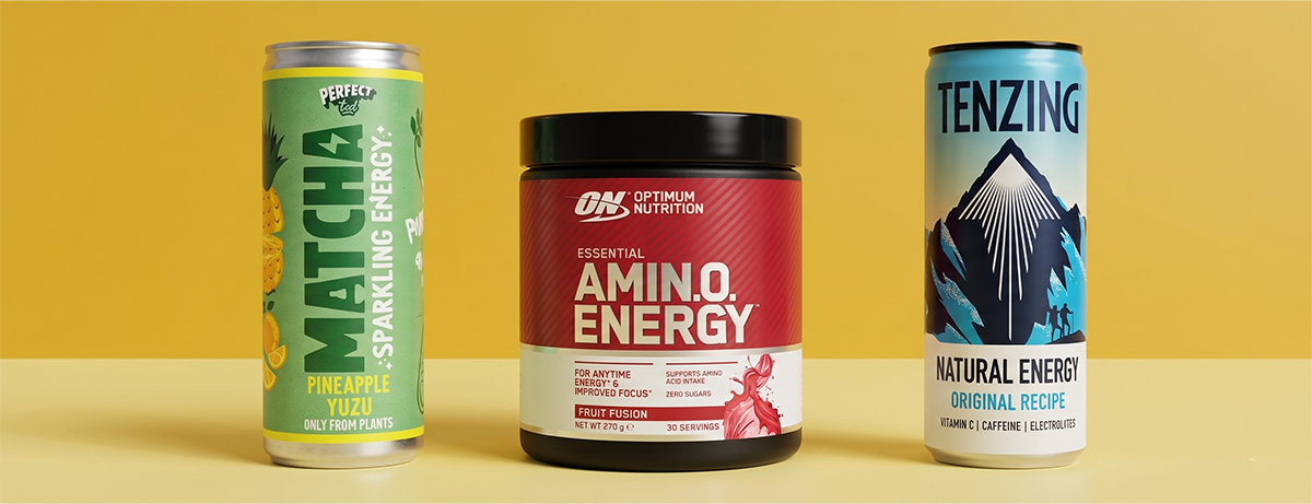 Selection of energy drinks on yellow background