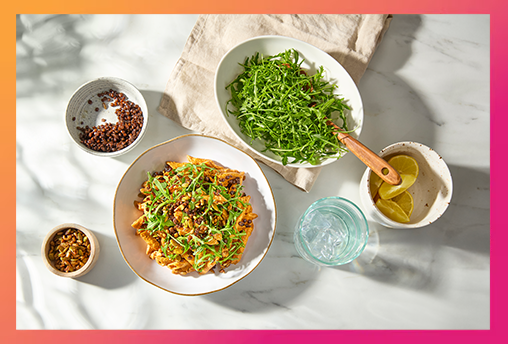 Portion of lentil pasta in white bowl