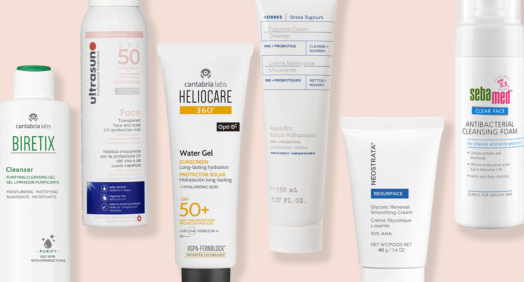 Selection of skincare products on light pink background