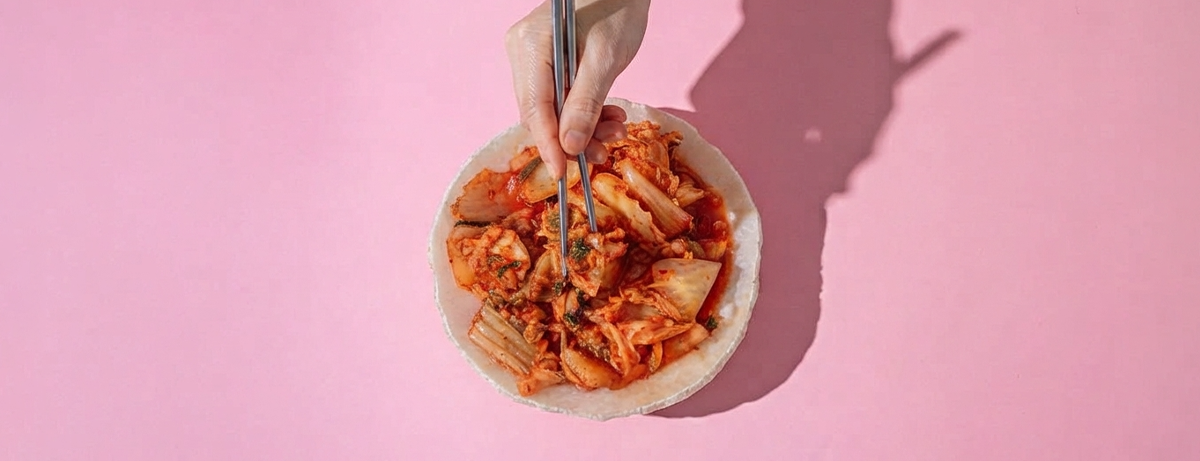 Fermented kimchi on pink background