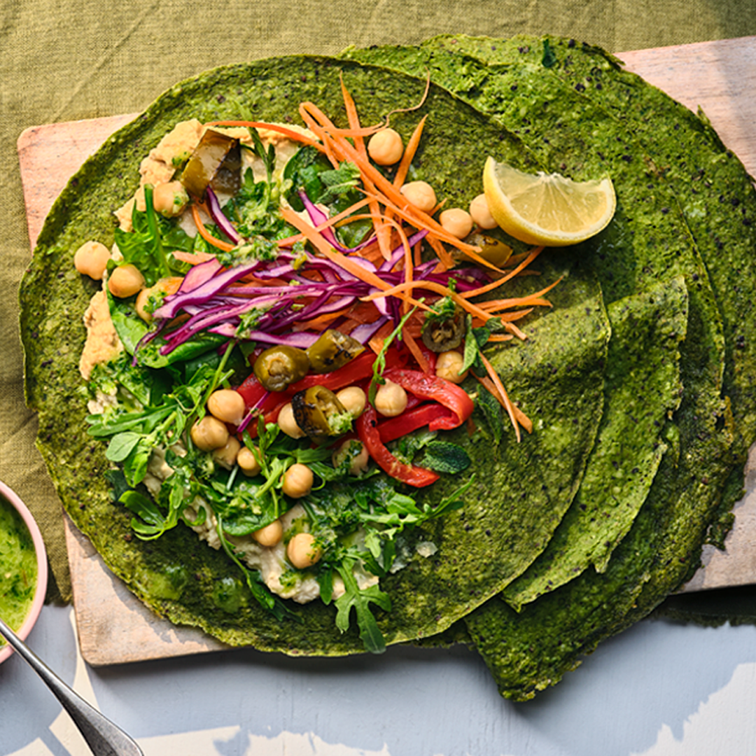 Spinach wrap with filling on a white background