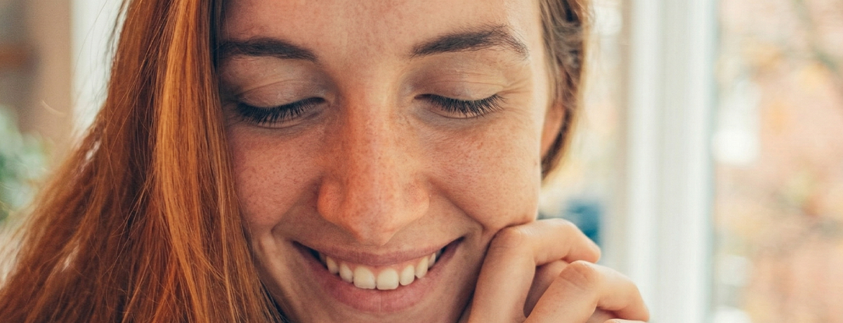 Female smiling looking slightly down away from the camera