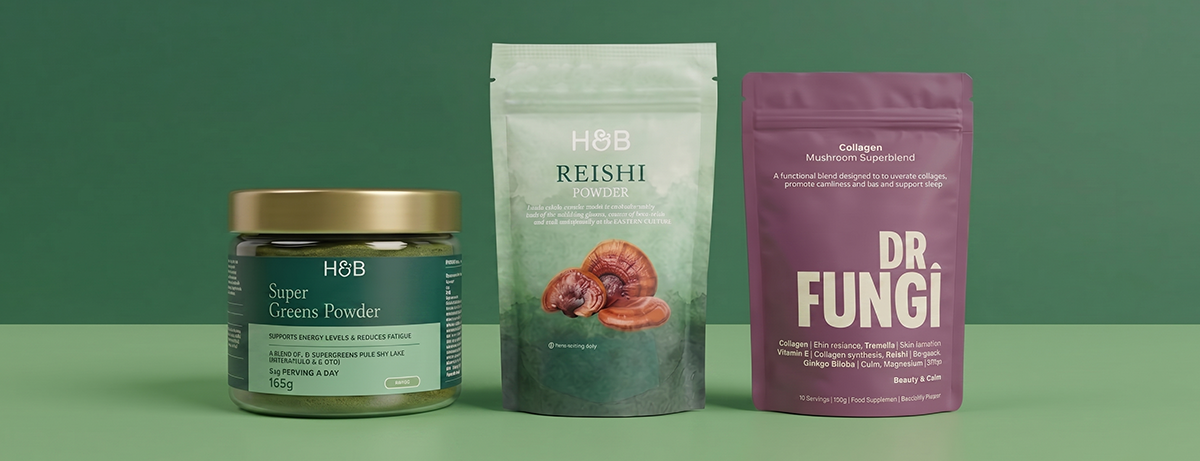 Selection of functional mushroom products on green background