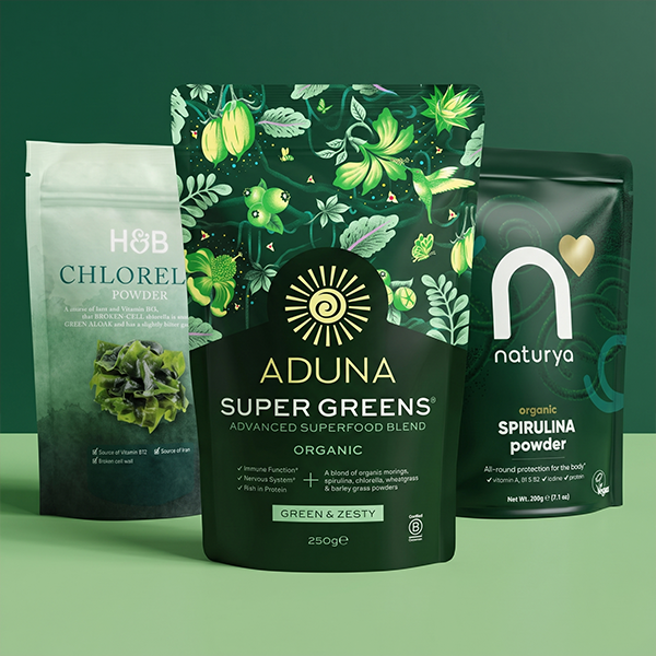 Selection of superfood powders on green background