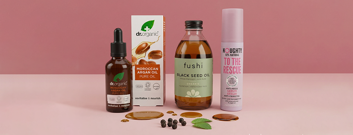 Selection of hair products on pink background