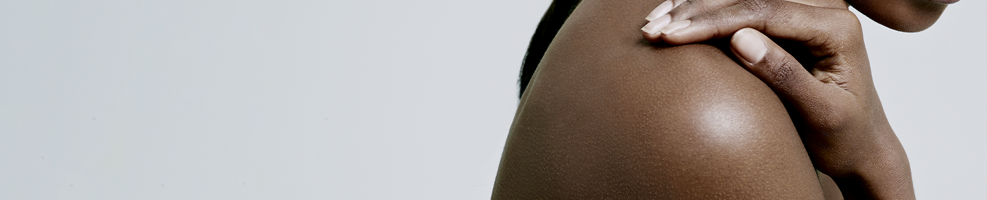 Female with hand on shoulder close up