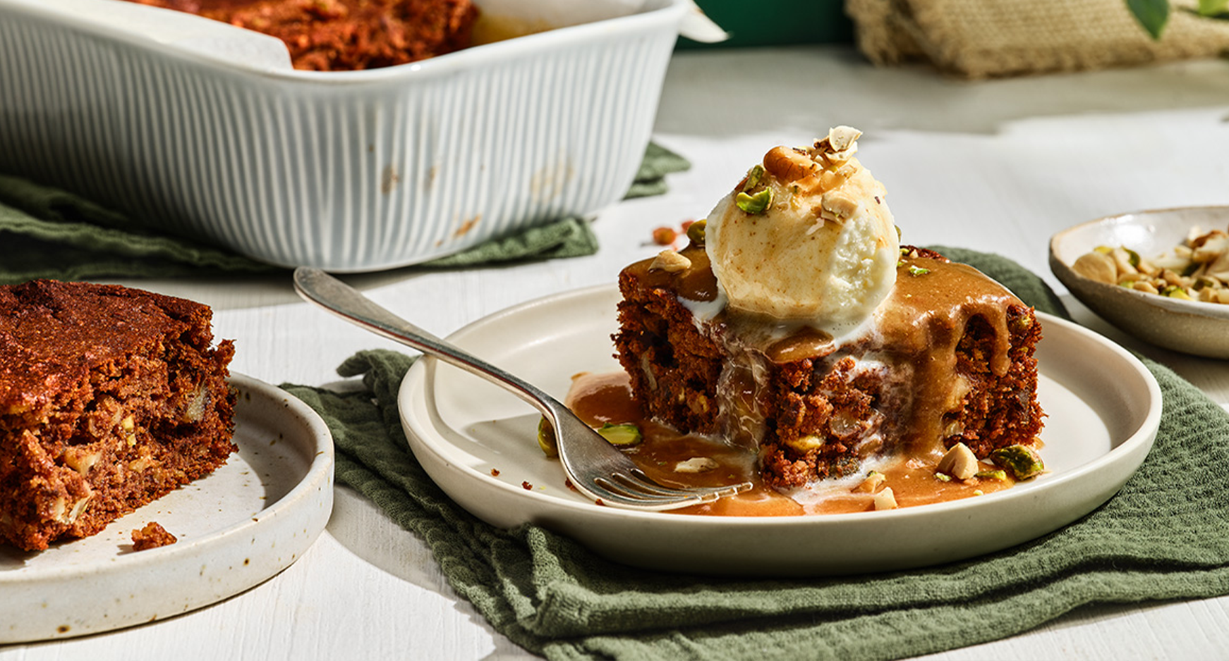 Sticky toffee pudding with ice cream on a plate