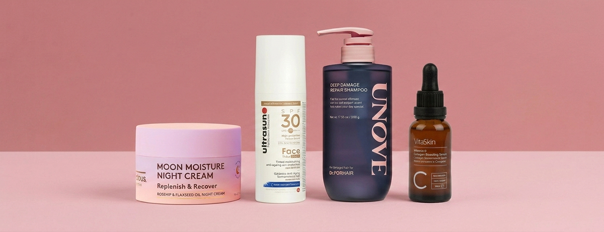 Selection of beauty products on pink background