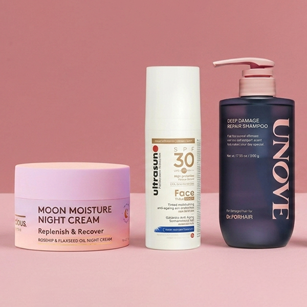 Holiday products on pink background