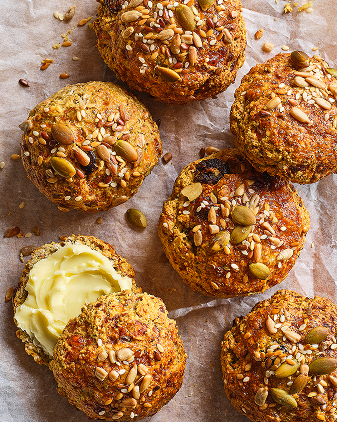 Seeded buns on greaseproof paper