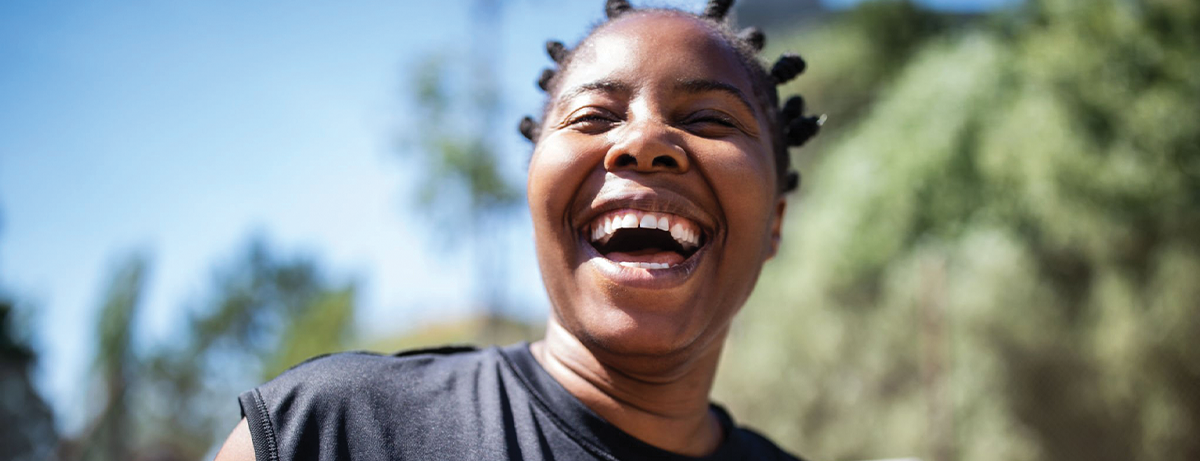 Female standing outside with happy expression