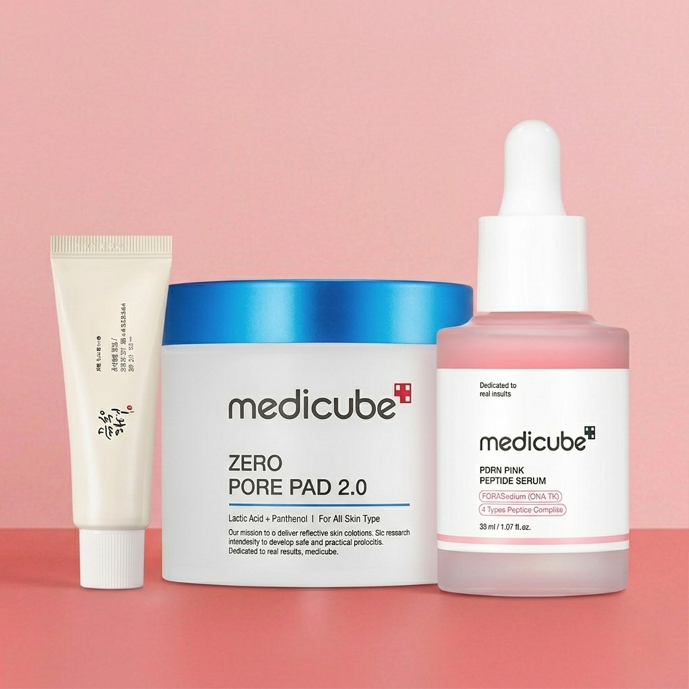 Selection of beauty products on pink background