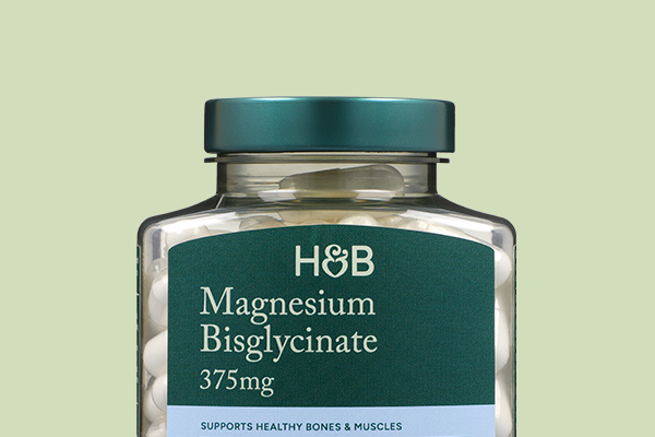 Magnesium bottle on green background