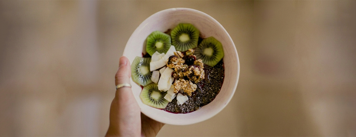 Portion of chia seeds and kiwi in a white bowl