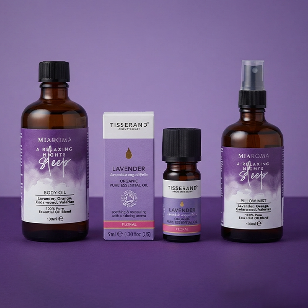 Selection of massage oil products on a purple backround