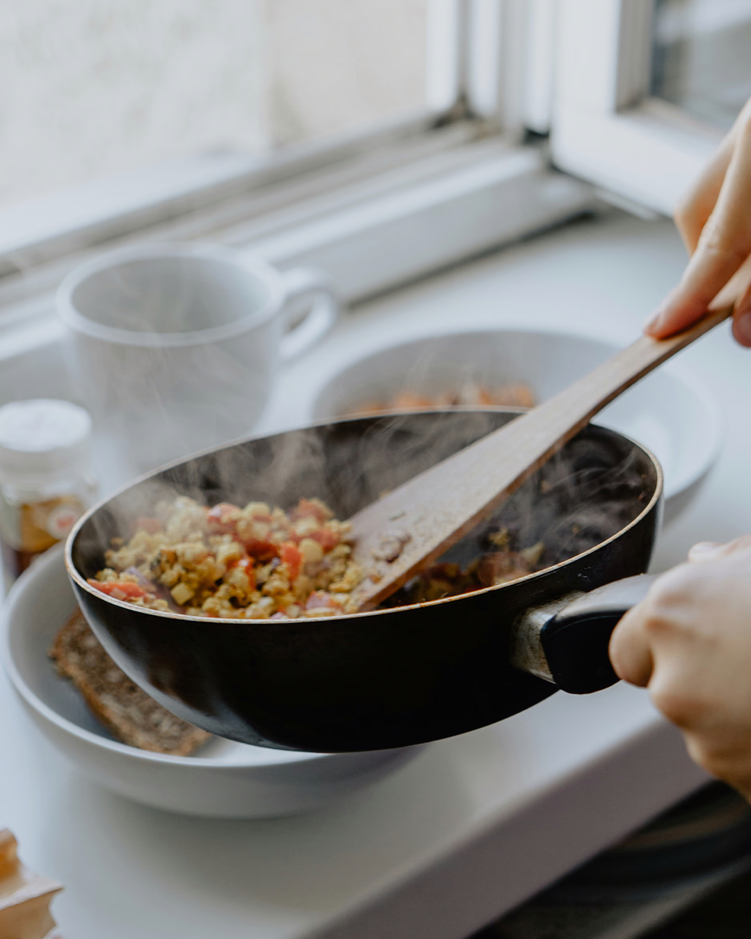 Close up of food simmering in a frying pan