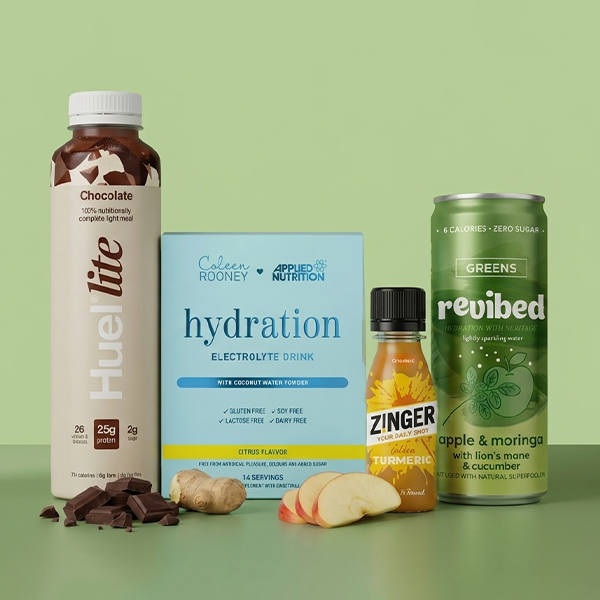 Selection of non-alcoholic drinks on green background