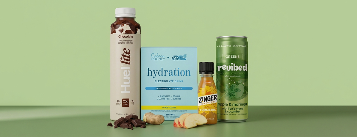 Selection of non-alcoholic drinks on green background