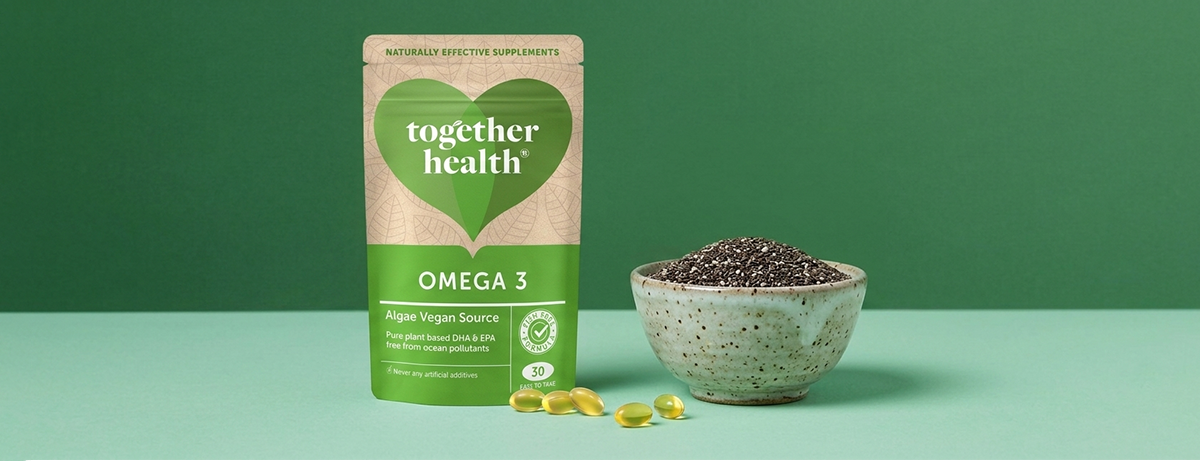 Omega-3 products and chia seeds on a green background