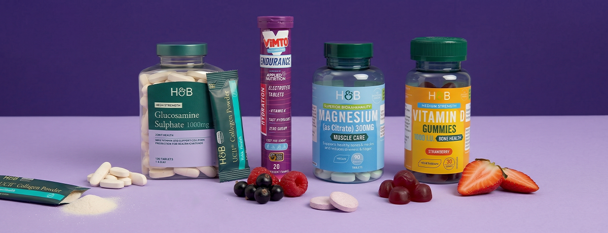 Selection of vitamins on purple background