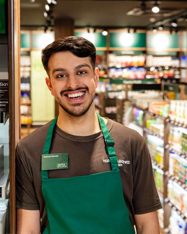 Male in store smiling at camera