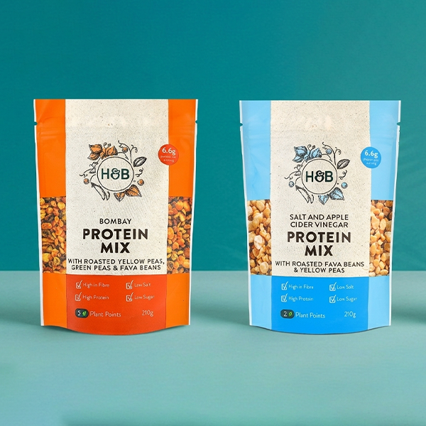 Selection of H&B snack pouches on blue background