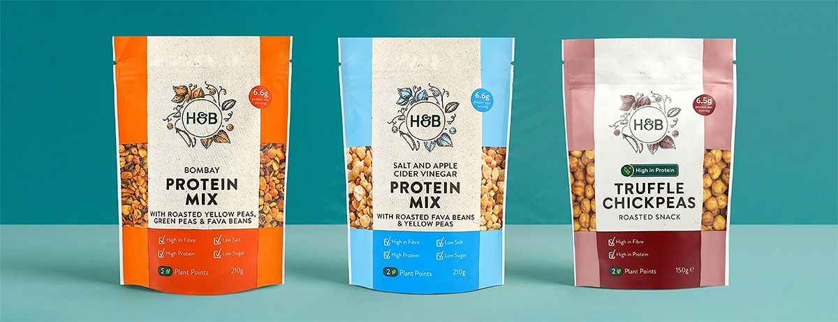 Selection of H&B snack pouches on blue background