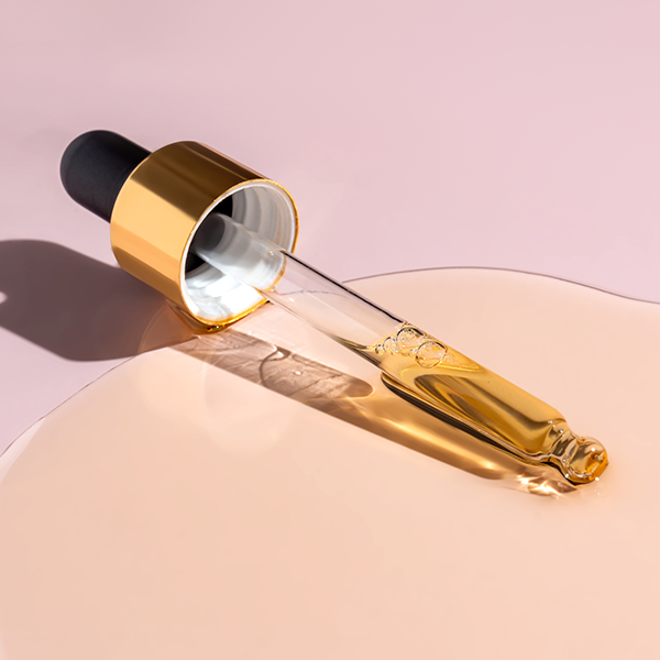 Beauty serum on pink background