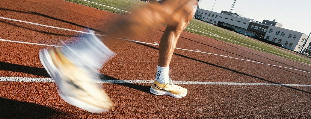 Close up of male legs on a running track