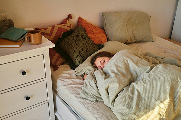 Female asleep on bed