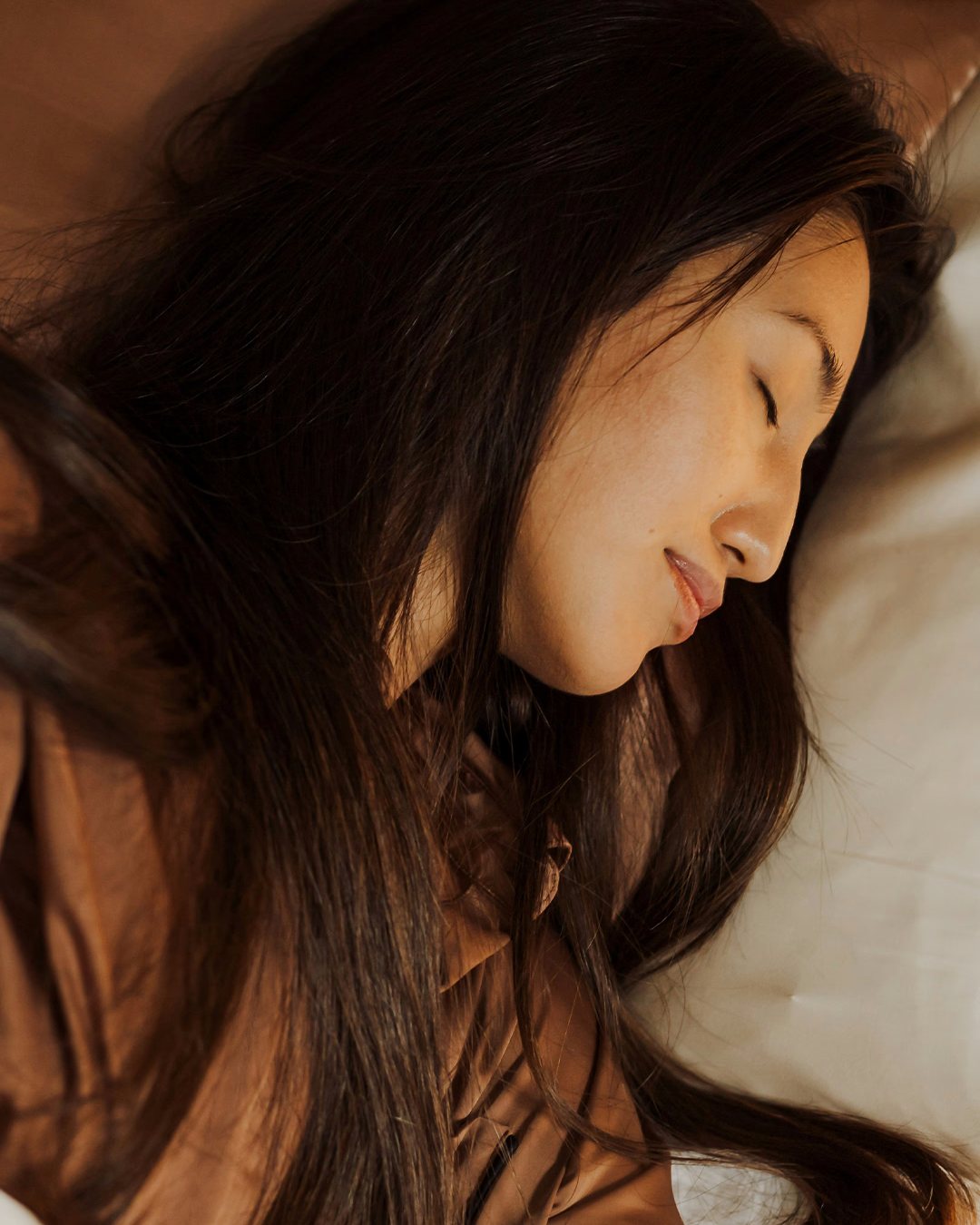 female asleep in bed