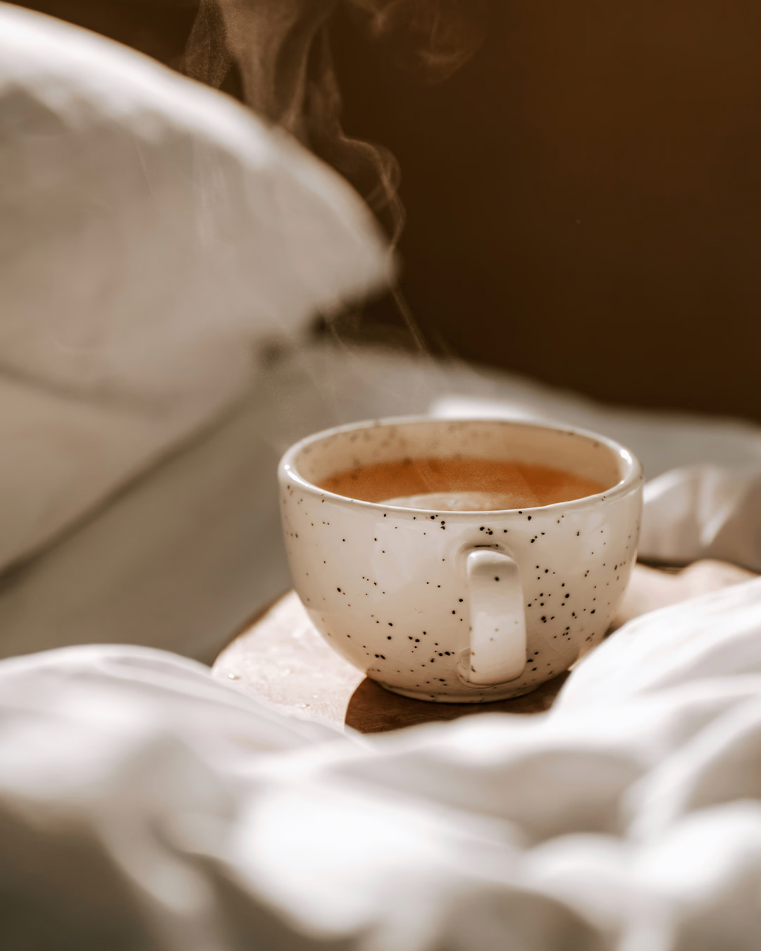 Cup of tea on bed