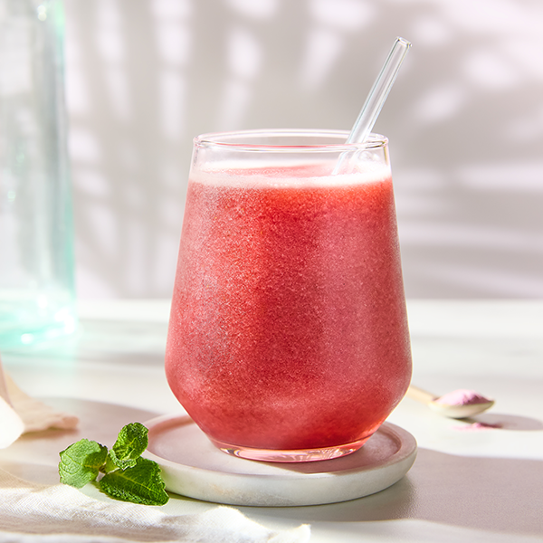 Gut smoothie in a glass on white background