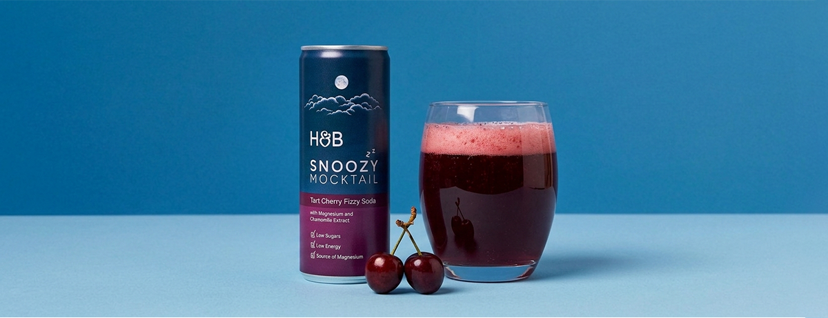 Snoozy mocktail with a glass on blue background