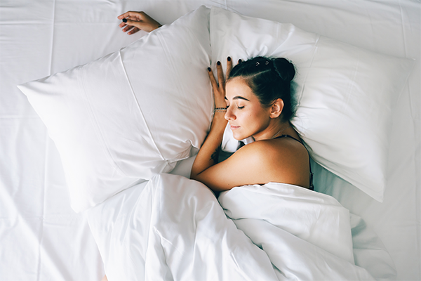 female asleep in bed