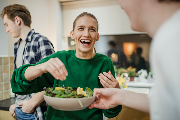 Friends preparing food in the kitchen