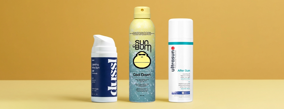 Selection of after sun products on a yellow background