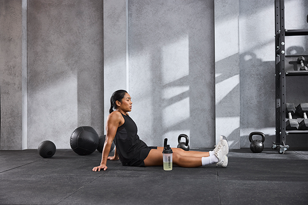 Female sitting on the gym floor